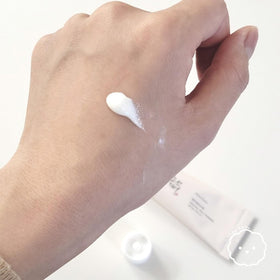 LING LI TE LLT sunscreen SPF50+ being applied for lightweight, non-greasy protection under makeup