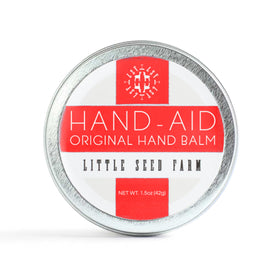 Little Seed Farm Hand-Aid balm jar close-up for nourished hands