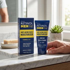 Person applying LIVAURA Retinol moisturizer as part of morning routine.