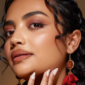 Live Tinted Huebeam gradient bronzer pigment close-up with radiant shimmer.