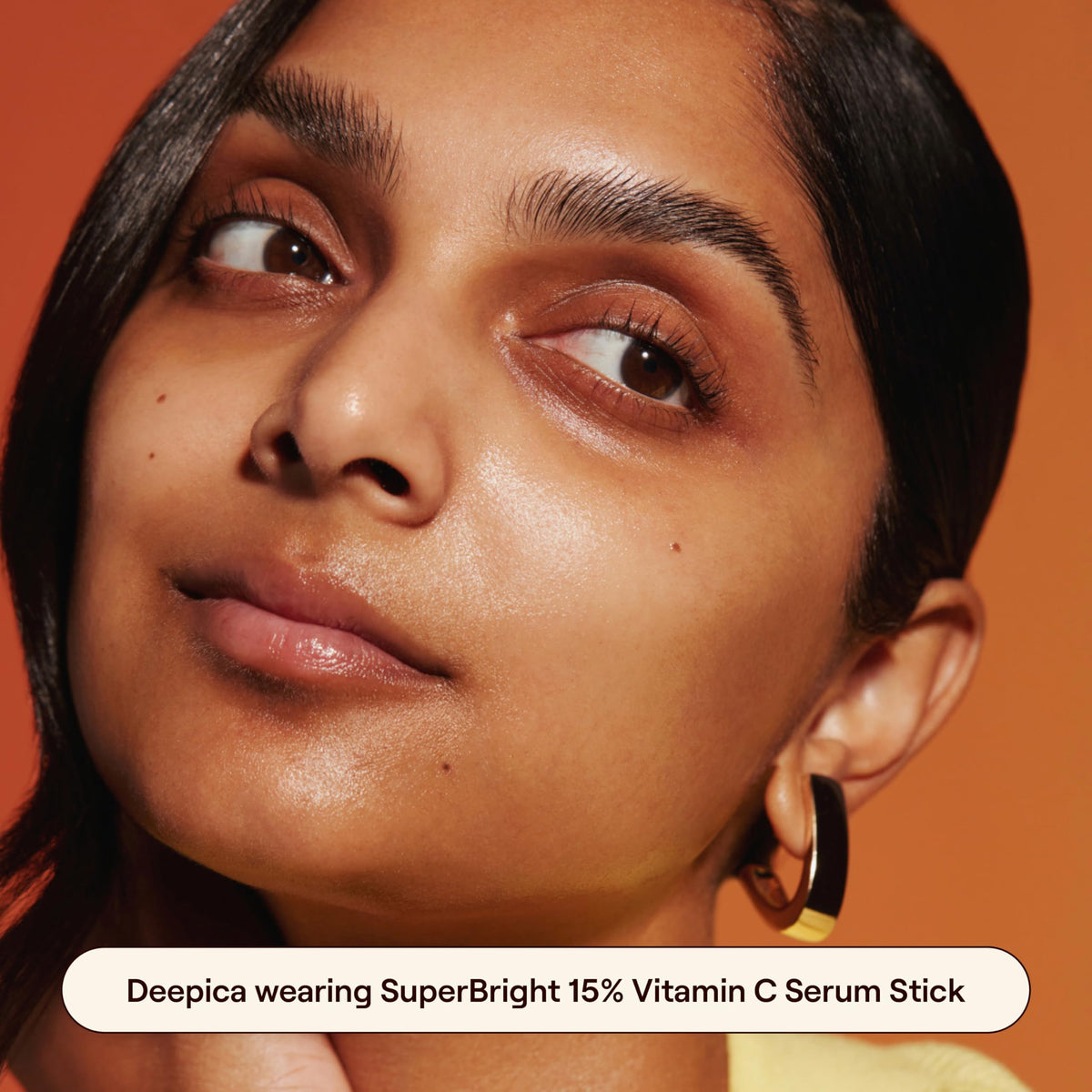 Applying the Live Tinted balm-to-serum stick for a smooth glow on skin