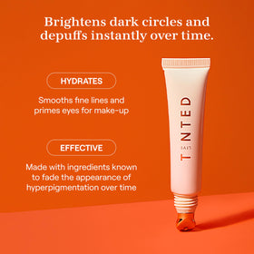 Live Tinted Superhue Eye Cream cooling applicator in use for refreshed eyes.