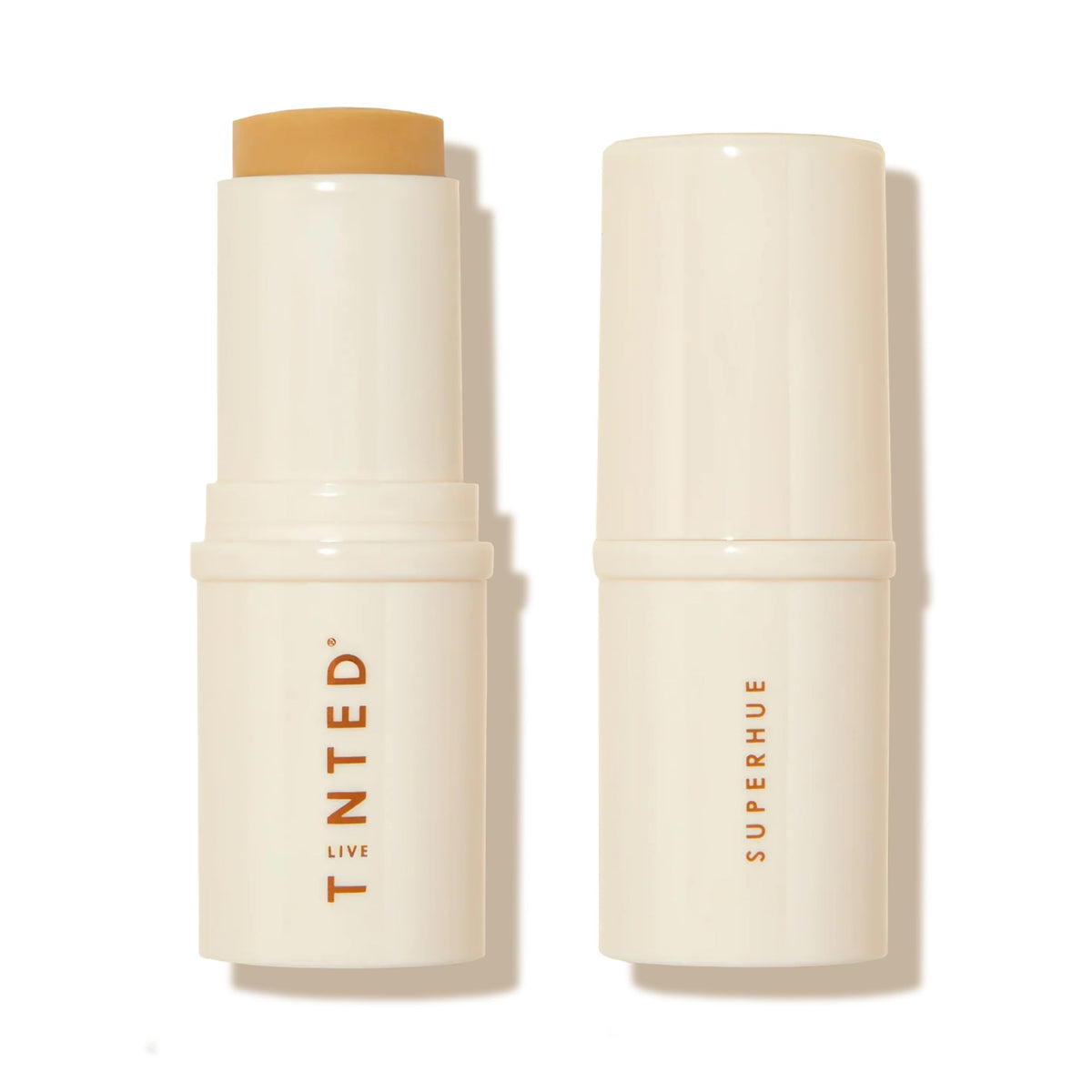 Live Tinted Superhue Stick applied to face for radiant, even tone.