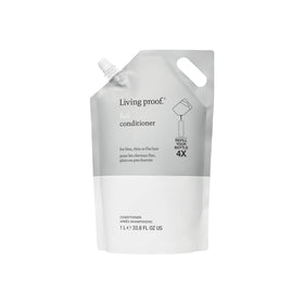Living Proof Full Conditioner bottle demonstrates volumizing, weightless fullness.