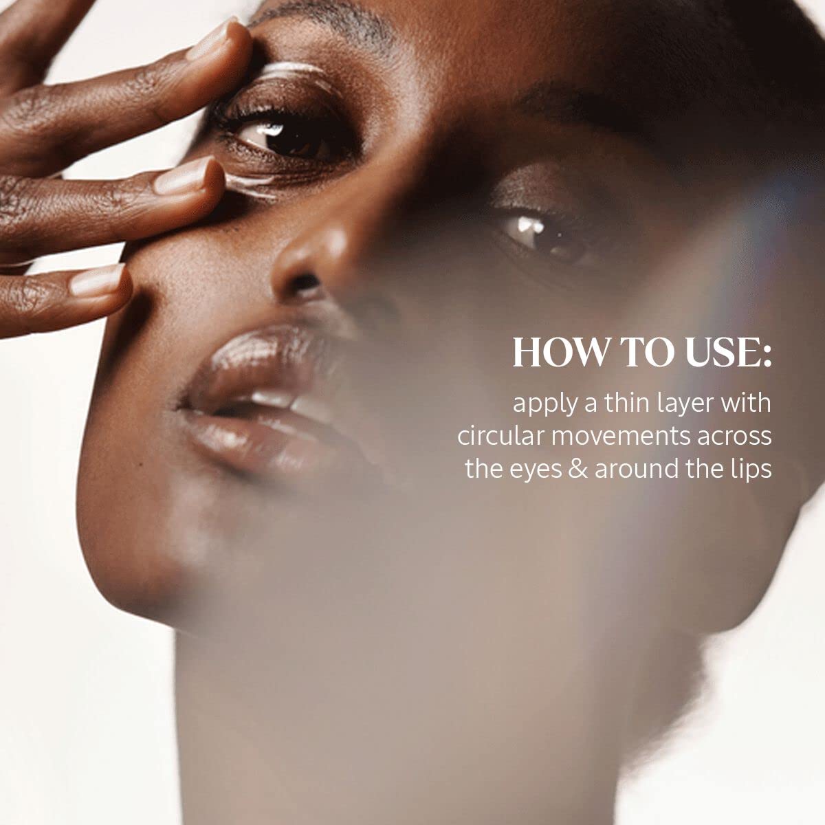 Applying Divine Eye Cream around the eye for smoothing and puffiness support.