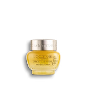L'Occitane Immortelle Divine Eye Balm jar shows a creamy formula for nourishing the eye contour.