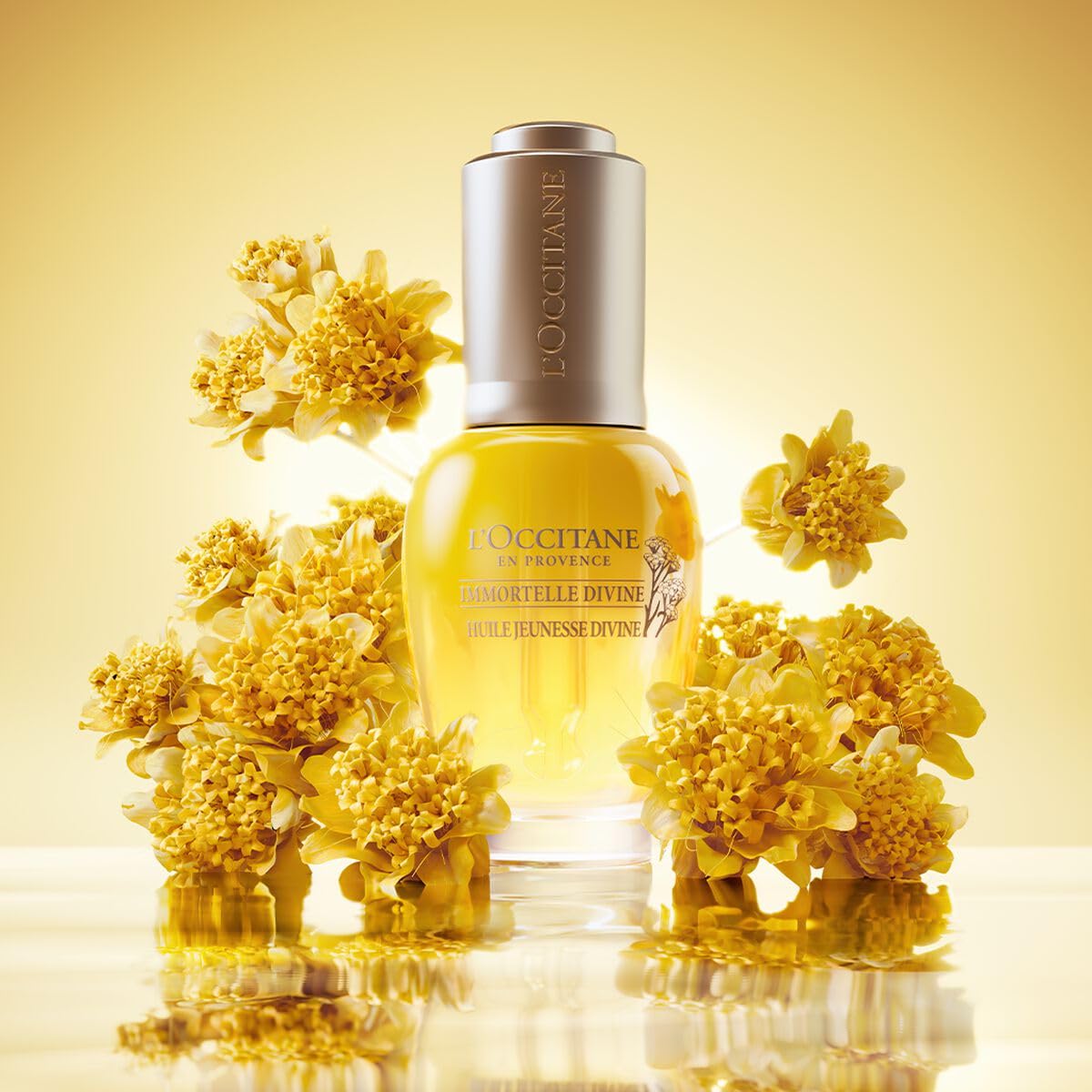 L'Occitane Immortelle Divine Oil packaging shot emphasizes premium formulation.