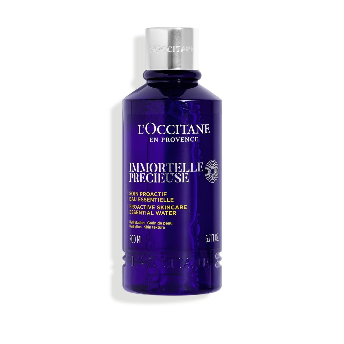 L'Occitane Immortelle Precious Essential Water bottle close-up for refreshing toning ritual.