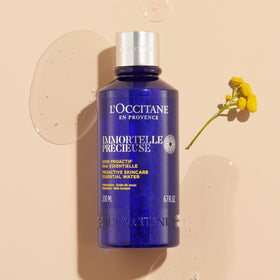 L'Occitane Immortelle Precious Essential Water mist in use for pores refinement.