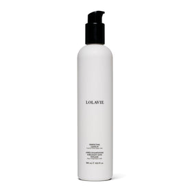 LolaVie Perfecting Leave-In bottle pour shows hydration for smoother, more manageable hair