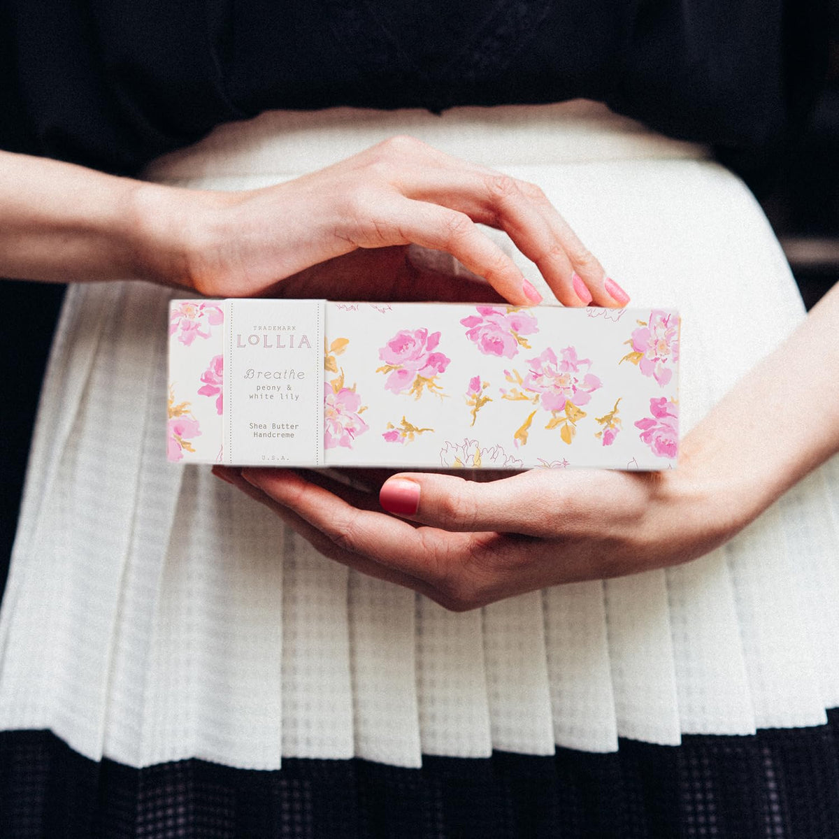 LOLLIA Breath Handcreme packaging displayed on vanity inviting daily use.