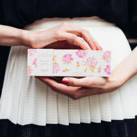 LOLLIA Breath Handcreme packaging displayed on vanity inviting daily use.