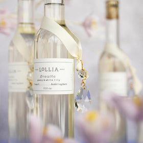 LOLLIA Breathe Bubble Bath luxury bath scene invites a serene self-care moment.