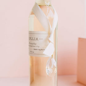 LOLLIA Breathe Bubble Bath peony white lily scent fills bath with floral calm.