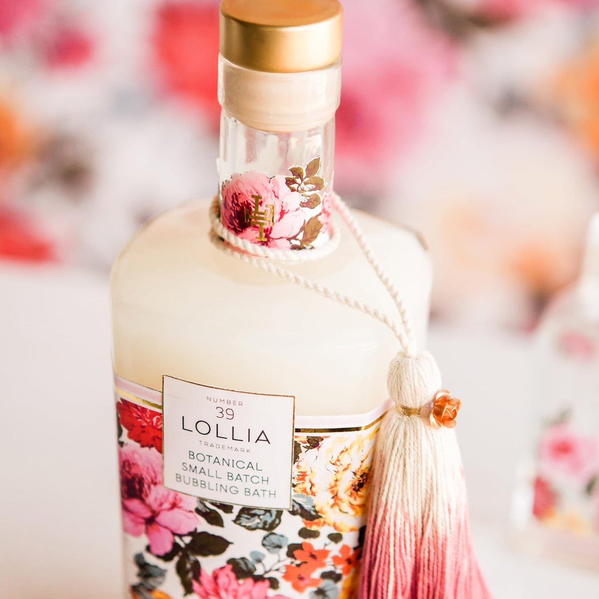 LOLLIA Always in Rose Bubble Bath glass bottle with gold cap adds elegant bathroom decor.