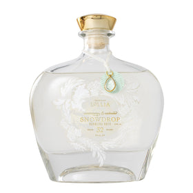 Lollia Snowdrop bubble bath bottle with frosted glass for a luxurious bath centerpiece.