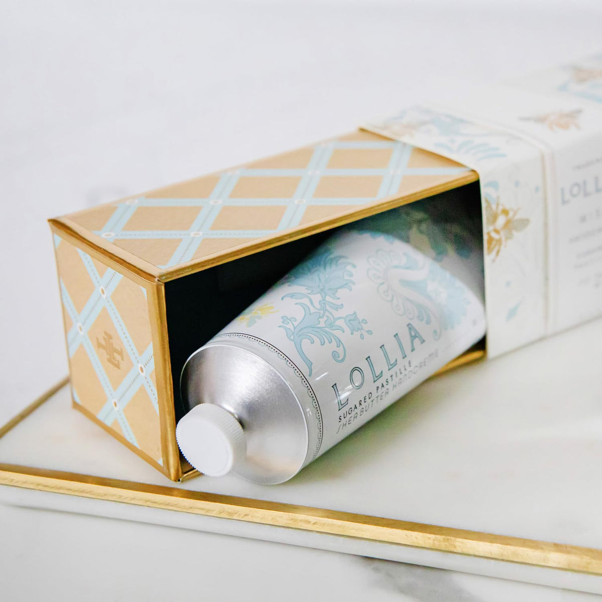 Purse-ready tube of LOLLIA Wish Handcreme.