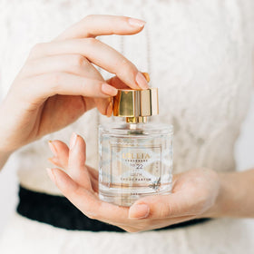 LOLLIA Wish lifestyle shot evokes daily self-care rituals with a charming fragrance.