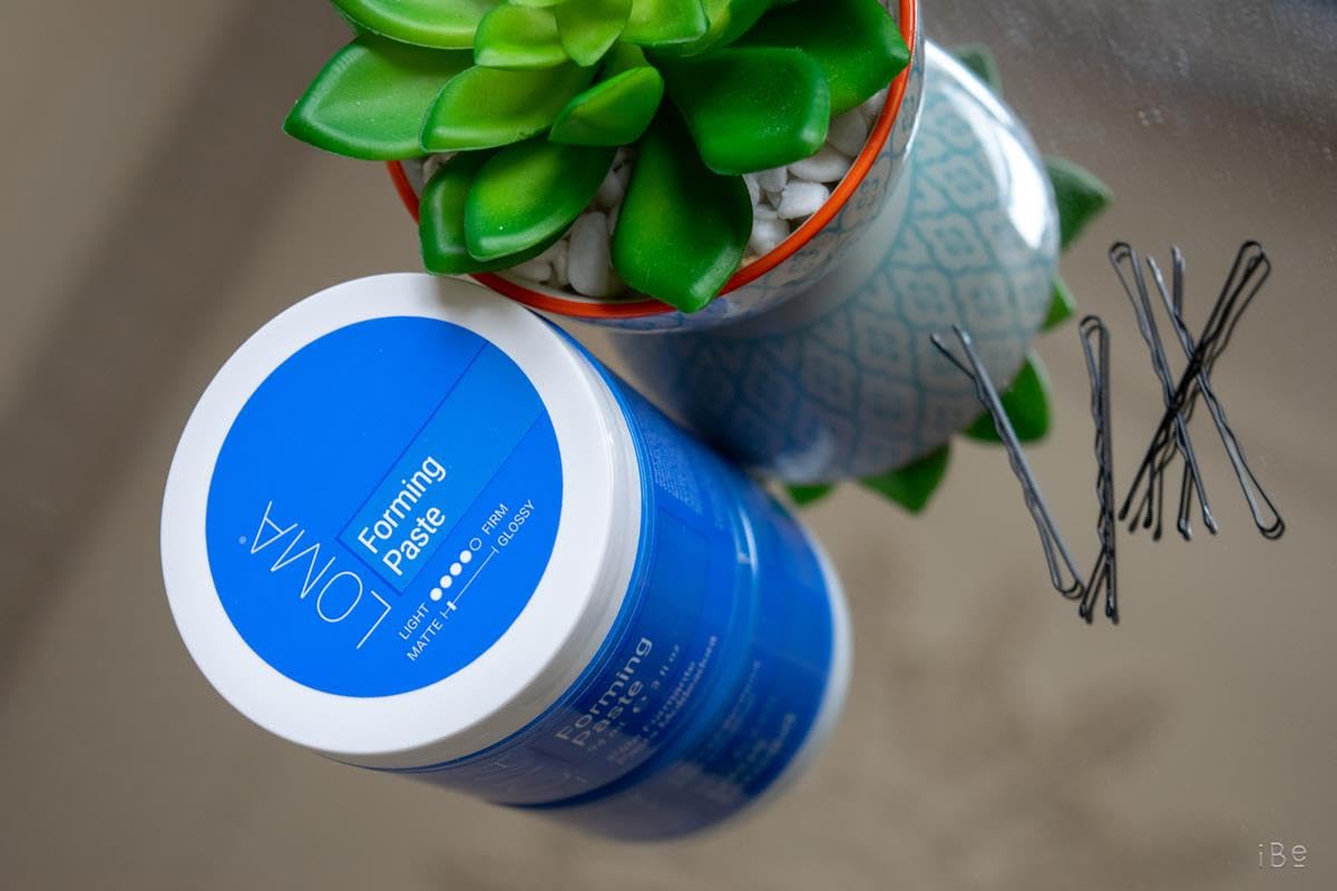 LOMA Forming Paste on damp hair for matte definition.