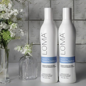 Loma fragrance-free conditioner being applied for smooth, manageable hair