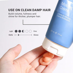 Close-up of Loma Molding Crème texture on hair for definition and separation.