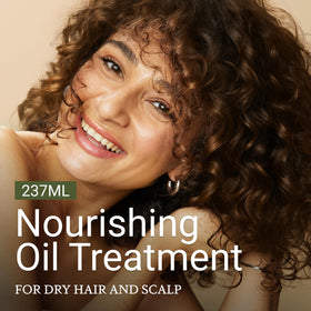 LOMA Nourishing Oil Treatment applied to hair for smoothing.