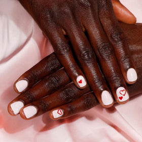 Nail hardener bond close-up reinforcing the natural nail surface.