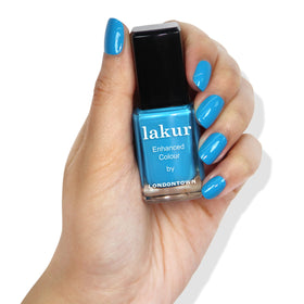 LONDONTOWN Lakur Nail Polish blue application shot illustrating even coverage
