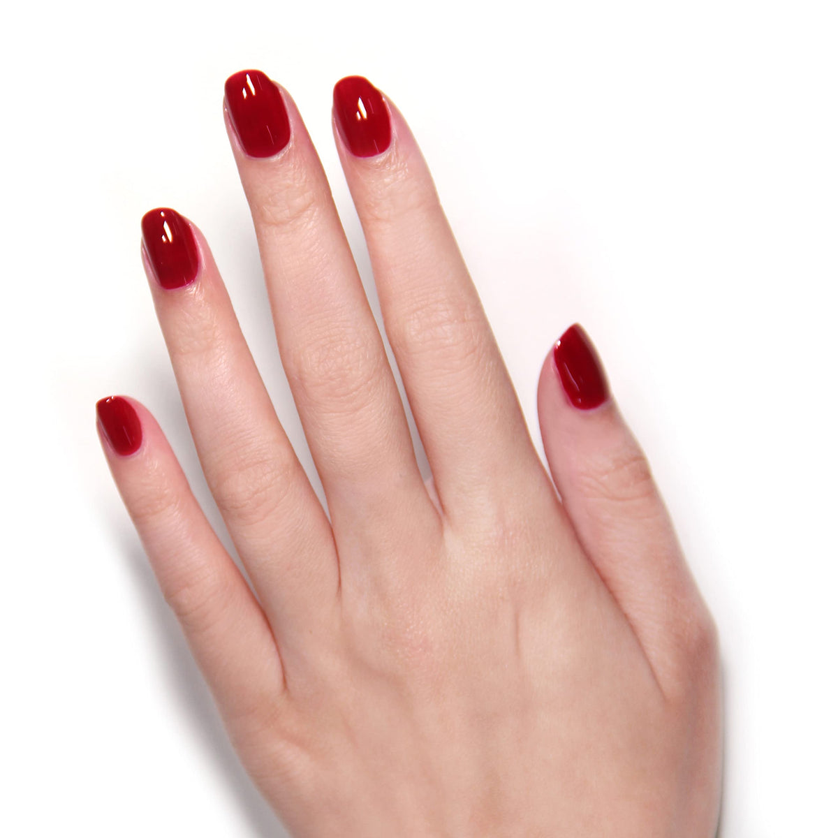 Vendetta Red swatch on nail showing vibrant pigment