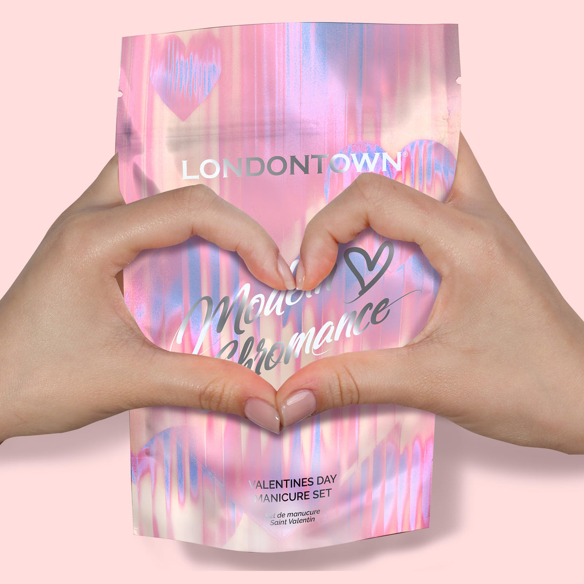 LONDONTOWN Complete manicure with sheer pink, chrome, and glass file benefits.