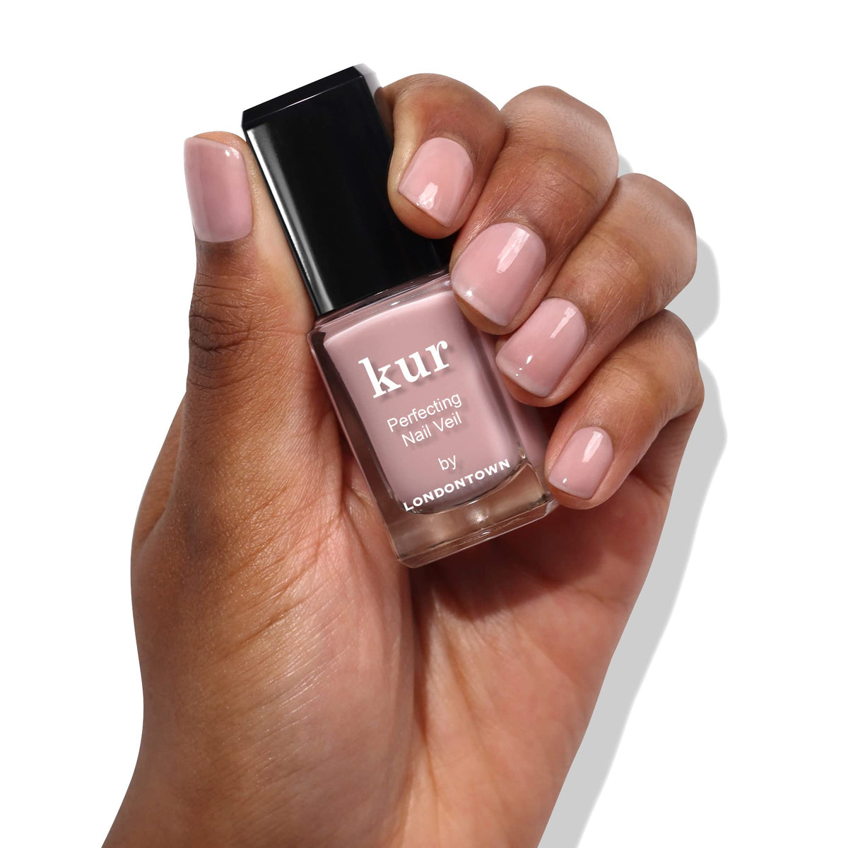 LONDONTOWN Perfecting Nail Veil Dusty Rose application on nails shows subtle color refinement.