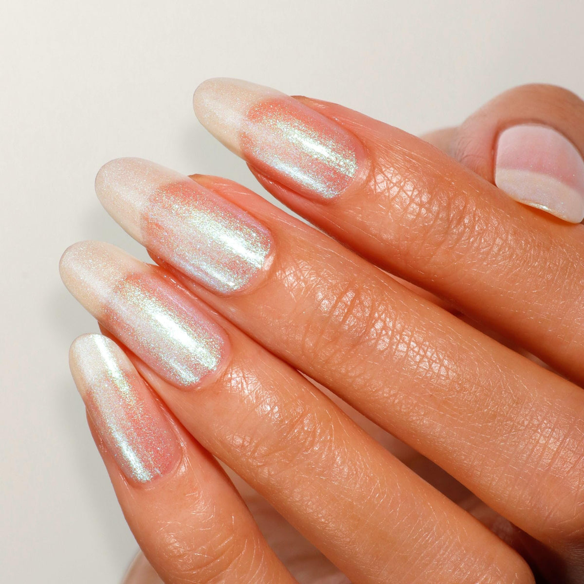 LONDONTOWN Shimmer Nail Highlighter swatch on nail reveals multi-dimensional color