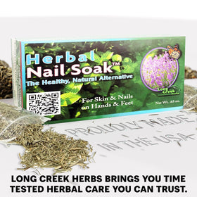 Hands soaking with Long Creek Herbs Nail Soak supporting nail comfort and gentle care.