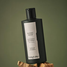 LONGTAKE Sandalwood Shampoo foamy-lather in hand demonstrates cleansing action.