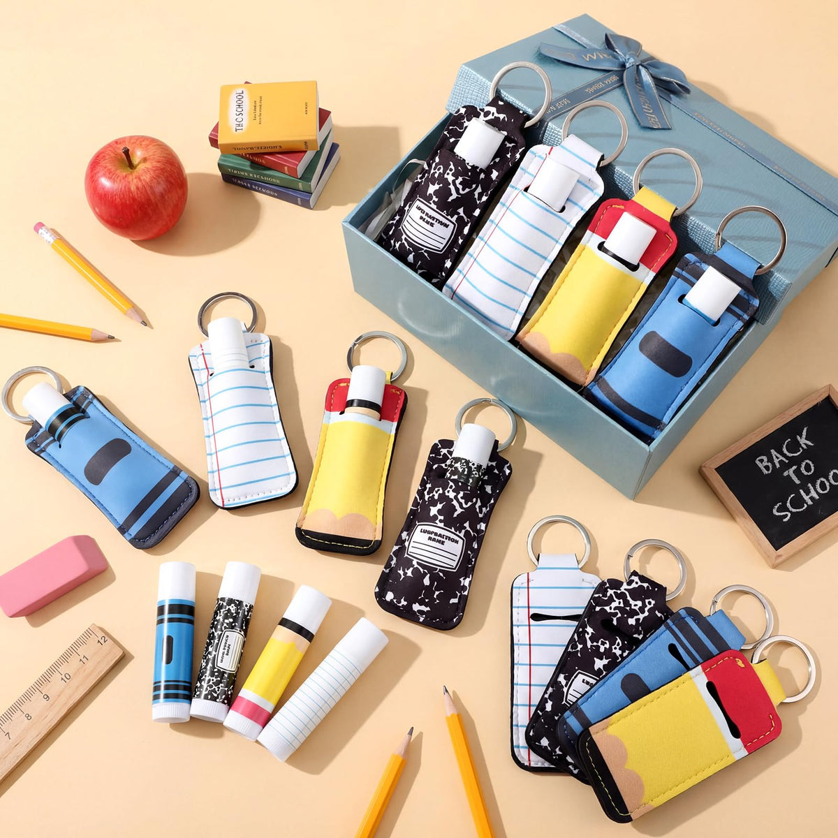 Loopeer teacher-themed lip balm holder keychain featuring crayon and notebook motifs.