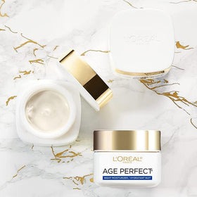L'Oreal Paris Age Perfect Night Cream being gently massaged into the skin.