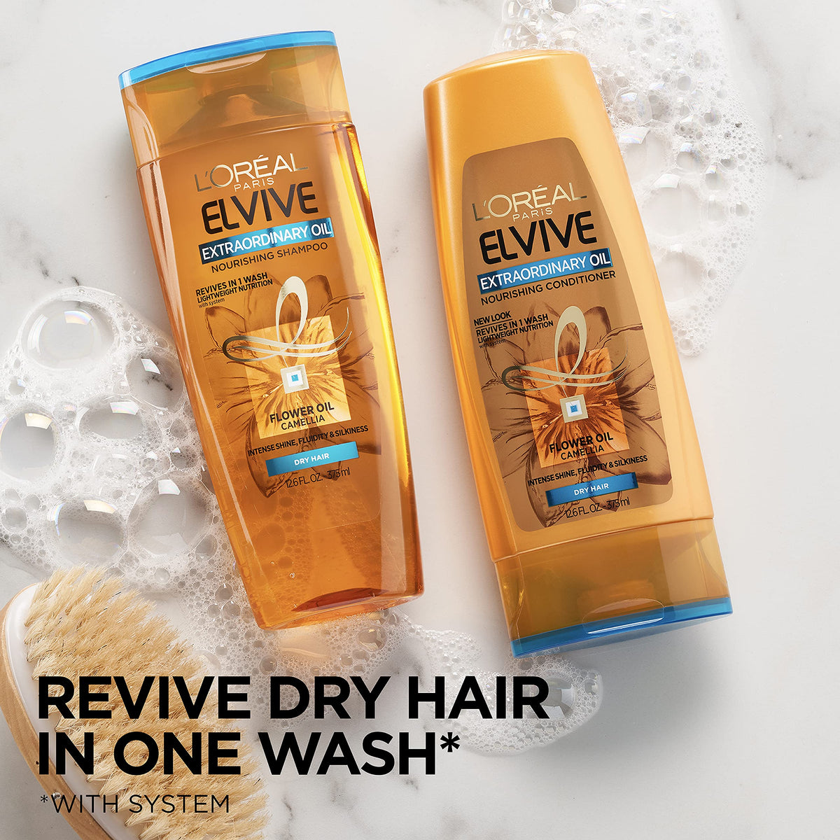 Elvive Extraordinary Oil Conditioner label close-up highlighting lightweight hydration for lifeless hair.