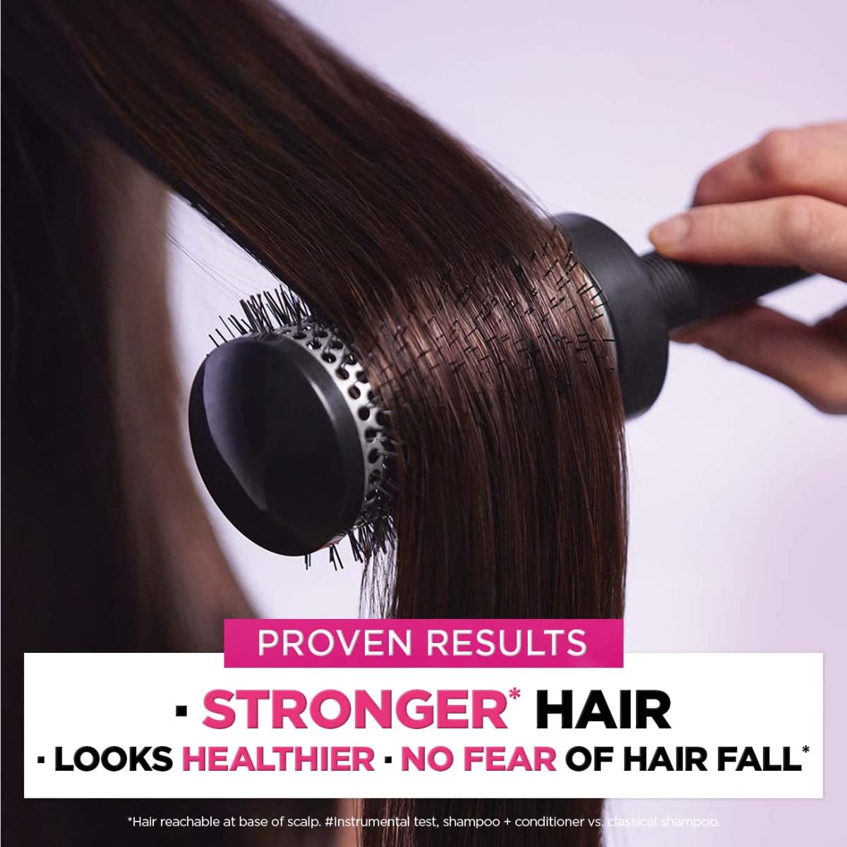 L'Oreal Paris Fall Repair 3X bottle against a clean bathroom backdrop.