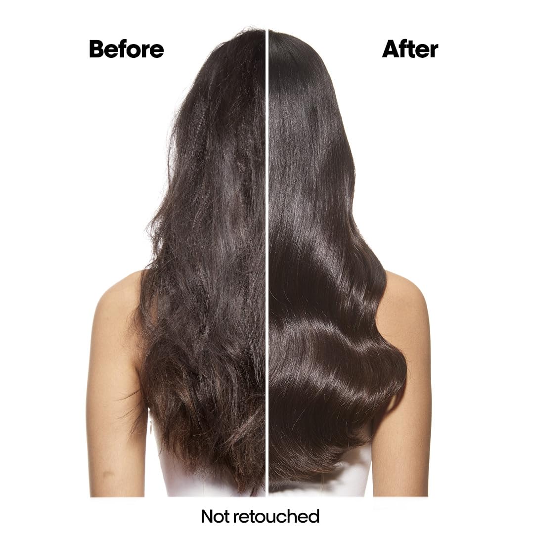 L'Oréal Professionnel Paris Absolut Repair refill bottle being poured with sulfate-free cleansing