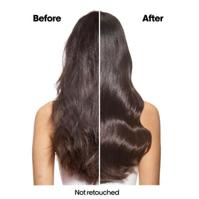 L'Oréal Professionnel Paris Absolut Repair refill bottle being poured with sulfate-free cleansing