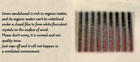 Closeup of Louise Maelys sandalwood showing natural wood grain and scent.