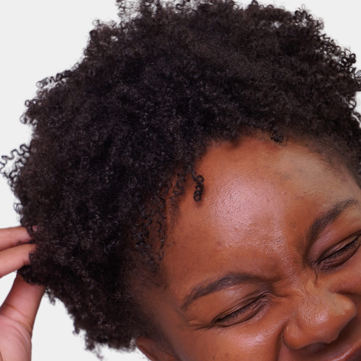 Love Ur Curls application shot demonstrates effortless smoothing and curl definition.