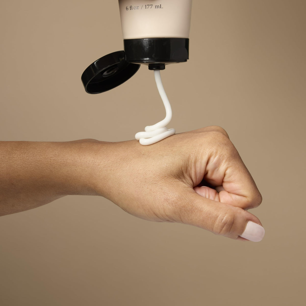 Loved01 Daily Face & Body Moisturizer applied to the body shows versatile daily use