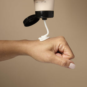Loved01 Daily Face & Body Moisturizer applied to the body shows versatile daily use