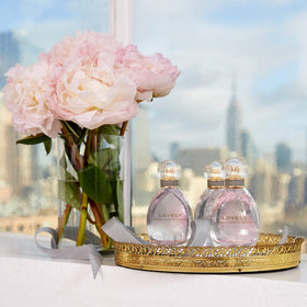 Lovely by SJP displayed on vanity adds a touch of elegance.