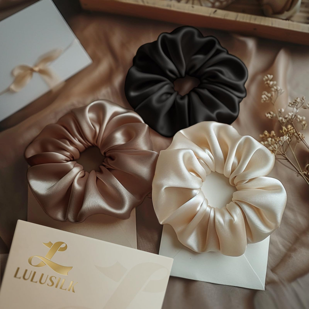LULUSILK hair protection scrunchie close-up, minimizes pull and breakage risk.