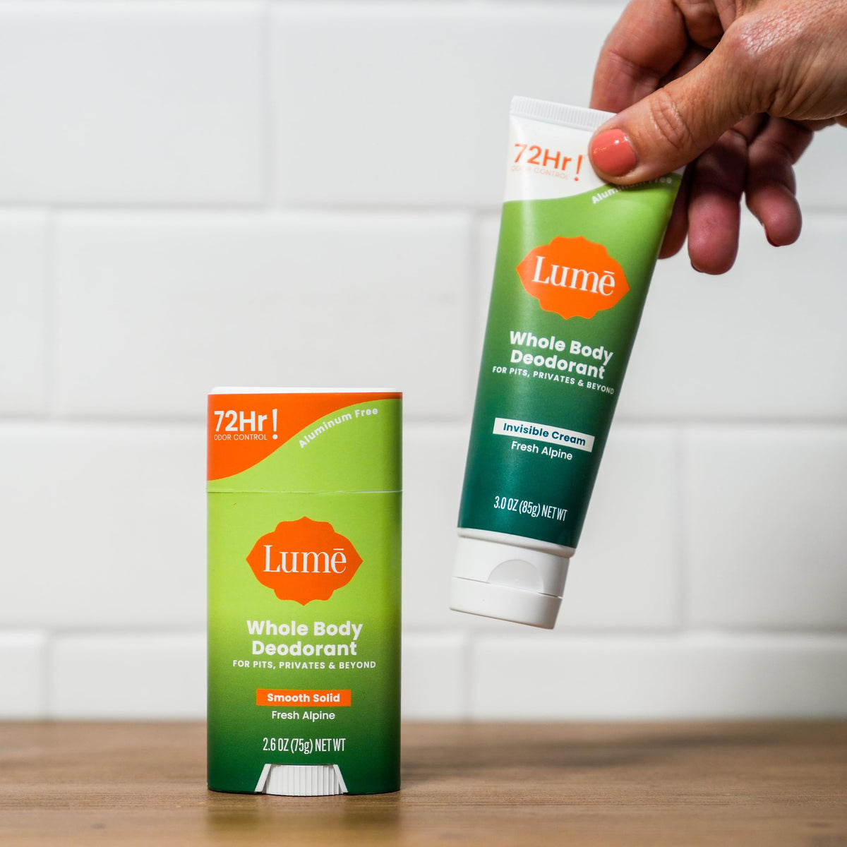 Lume cream tube application close-up demonstrates silky texture for even coverage.