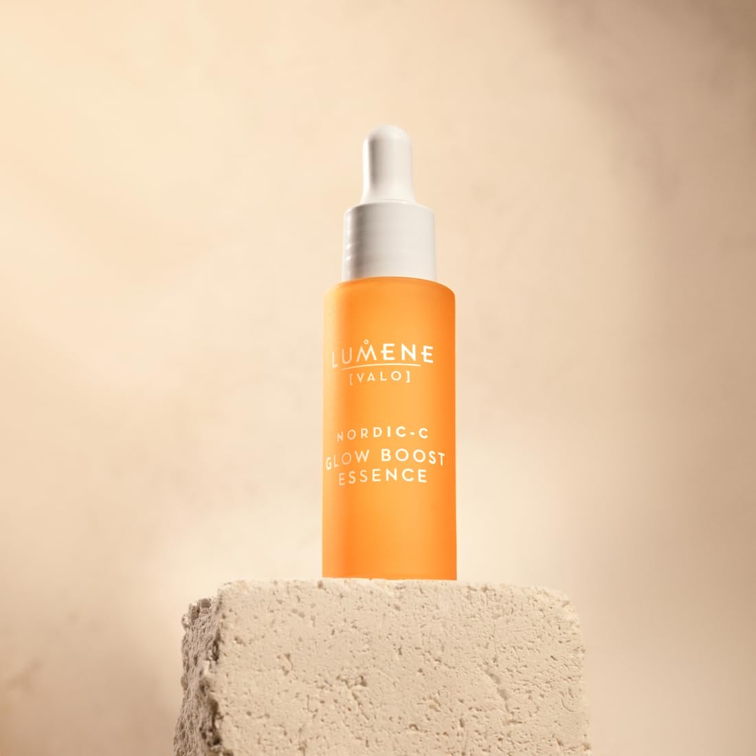 Close-up of Lumene Glow Boost Serum droplets illustrating hydration.