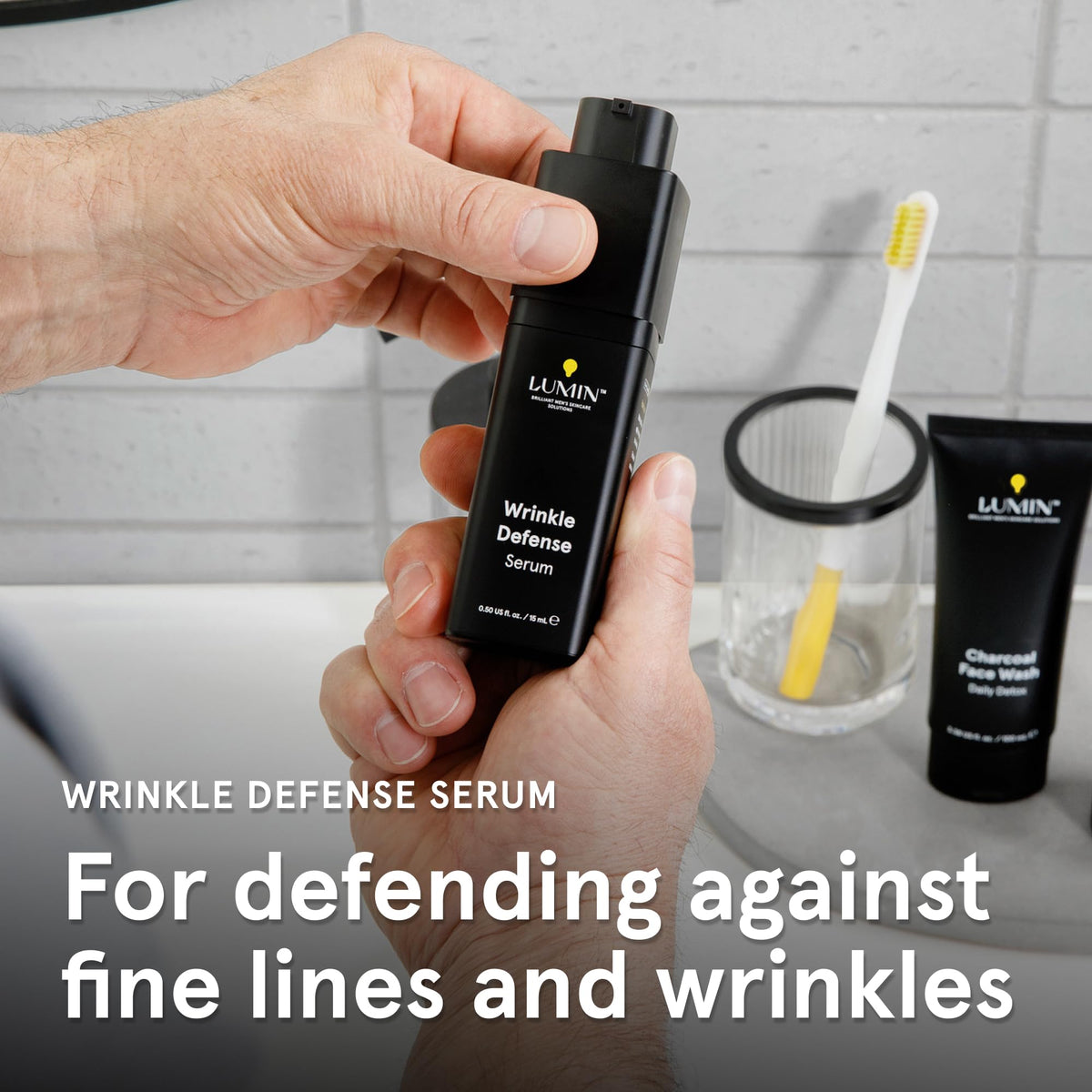 Man applying Lumin Wrinkle Defense Serum after a shower