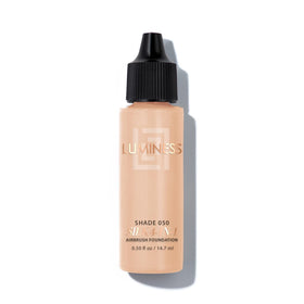 Luminess Silk4-In-1 airbrush foundation bottle 050 showing hydrated, smooth skin potential.